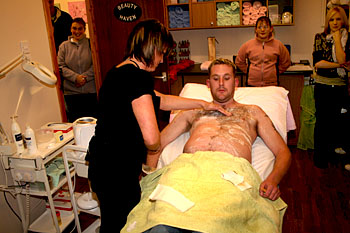 Paul relaxed as Tracy rips off his chest hair
