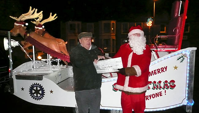 Santa hands over cheque