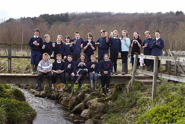 Pupils ready to release young salmon