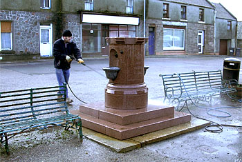 Power-washing the fountain