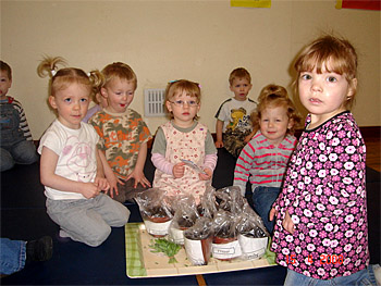 Children with their sunflower pots