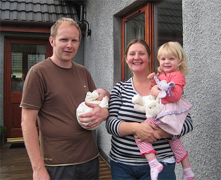 New born Kirsty with dad, mum & sister